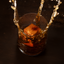 Cherry wood ice cubes splashing into a glass of whiskey.