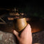 Pouring whiskey in an oak whiskey cup