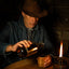 An American Cowboy Sipping From an Oak Whiskey Tumbler